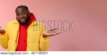 Close-up Clueless Unaware Handsome Stylish African-american Bearded Man In Yellow Jacket Shrugging H