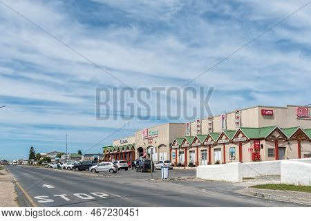 Struisbaai, South Africa - Sep 21, 2022: A Street Scene, With The Schonberg Shoping Centre And Vehic