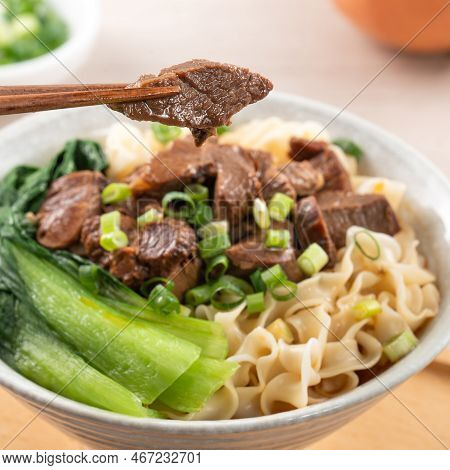 Beef Noodle Soup. Taiwanese Famous Food In A Bowl On Wooden Table.
