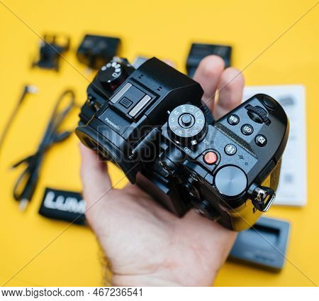 Paris, France - Nov 20, 2022: Male Photographer Hand Holding Looking At Controls And Knobs Of New Pa