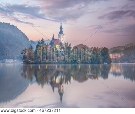 Amazing Sunset View Of Popular Tourist Destination  Bled Lake. Dramatic View Of Pilgrimage Church Of