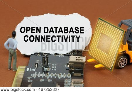 Computer Concept. On The Board With Microcircuits Lies A Paper Plate With The Inscription - Open Dat