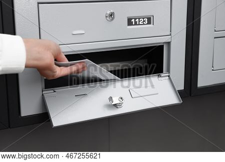 Woman Taking Envelopes Out From Mailbox Indoors, Closeup