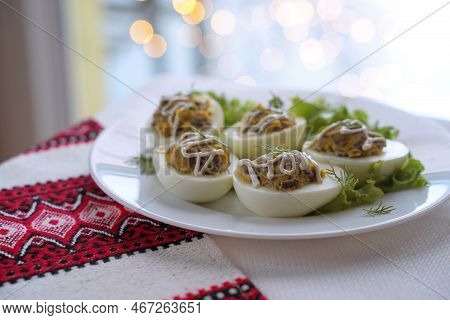 Deviled Eggs Aka Stuffed Eggs. Traditional Ukrainian Food On The Table With Embroidered Tablecloth.
