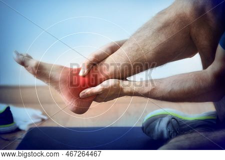Detail Of A Representation Of Pain In The Ankle With Red Color On A Bluish Image.