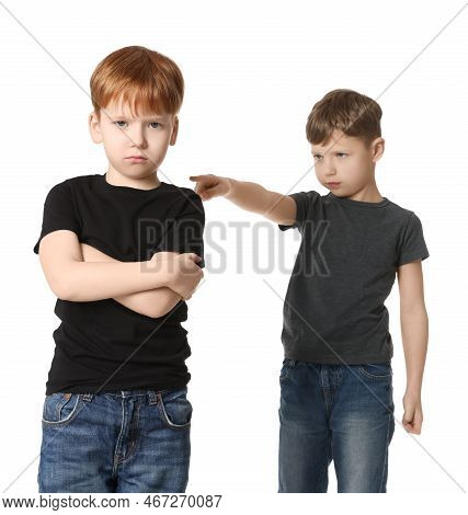 Boy Pointing At Upset Kid On White Background. Children's Bullying