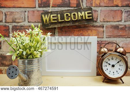Empty Photo Frame Mock Up With Welcome Sign And Artficial Plant Home Decoration