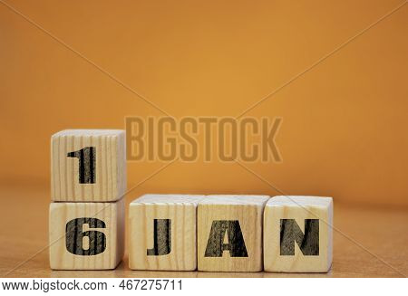 Cube Shape Calendar For January 16 On Wooden Surface With Empty Space For Text, New Year Wooden Cale