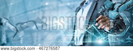 Manager Industrial Engineer Using Tablet Check And Control Automation Robot Arms Machine In Intellig