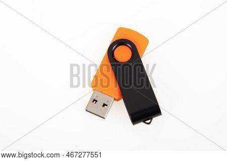 Orange And Black Steel Key Usb Flash Drive In White Background