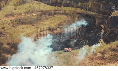 Bush Fire And Smoke. Drought Fire Engine, Truck On Firefighting Operation. Wild Open Fire Destroys G