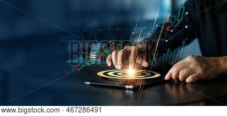 Businessman Touching Pie Chart On Tablet And Analyzing Sales Data And Economic Growth Graph Chart. F