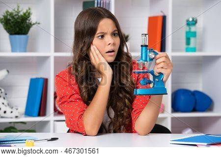 Chool Student Girl With Microscope. Serious Teenager Schoolgirl.