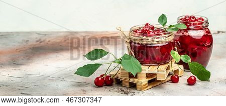 Jar Of Cherry Jam And Sour Cherries. Berries Cherry With Syrup. Ripe Ripe Cherries. Sweet Red Cherri