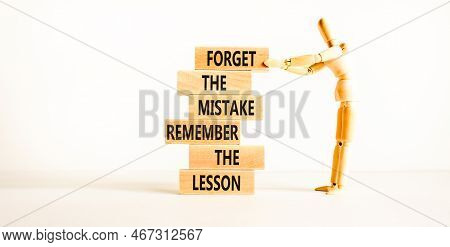 Lesson From Mistake Symbol. Concept Words Forget The Mistake Remember The Lesson On Wooden Blocks On