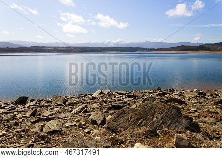 View Of The Barcena Reservoir With The Montes Aquilanos Mountain Range At Background. El Bierzo, Cas