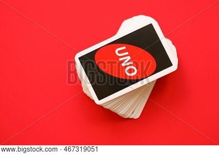 Ternopil, Ukraine - May 15, 2022: Many Colorful Uno Game Cards On Red Background Close Up. Uno Is An