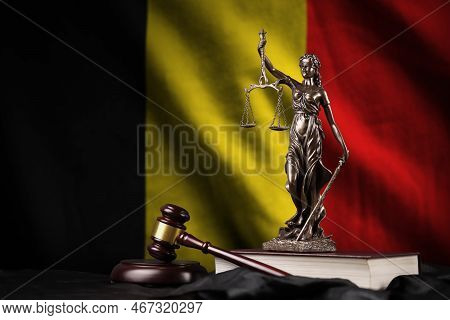 Belgium Flag With Statue Of Lady Justice, Constitution And Judge Hammer On Black Drapery. Concept Of