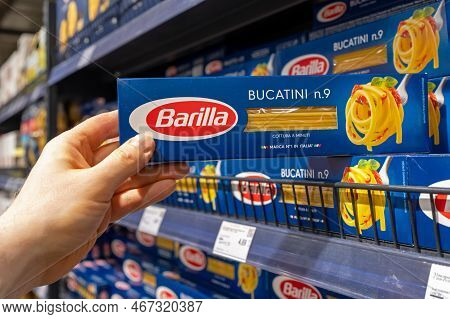 Barilla Pasta. A Customer Takes A Package Of Barilla Pasta From A Supermarket Shelf. The Company Was