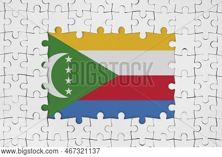 Comoros Flag In Frame Of White Puzzle Pieces With Missing Central Parts