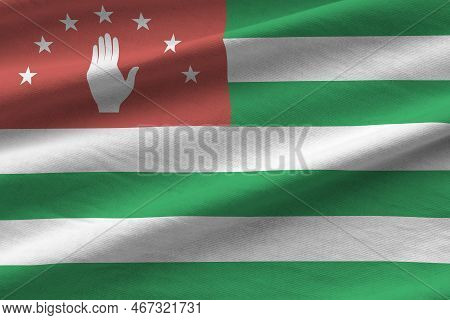 Abkhazia Flag With Big Folds Waving Close Up Under The Studio Light Indoors. The Official Symbols An