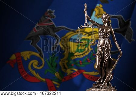 Pennsylvania Us State Flag With Statue Of Lady Justice And Judicial Scales In Dark Room. Concept Of 