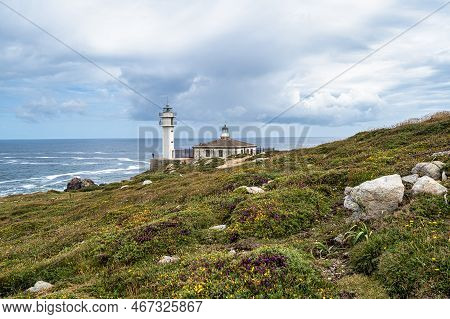 Lighthouse Of Cape Of Tourinan In Muxia, Costa Da Morte, Death Coast, Galicia, Spain. These Cliffs A