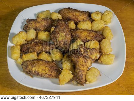 Chicken Wings Served With  Tater Tots On