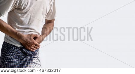 Asian Young Man Suffering From Upper Abdominal Pain. It Can Be Caused By Stomach Ache, Enteritis, Co