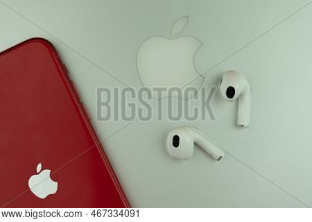 Bangkok, Thailand - December 17, 2022 : Apple Airpods 3 Next To Iphone 11 Product Red Model Placed O