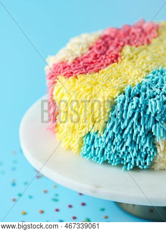 Shag Cake On Blue Background. Funny Colorful Vanilla Shag Cake With Perfect Vanilla Buttercream. Ide