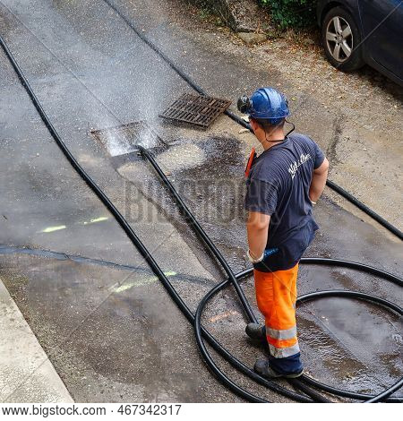 Menthon Saint Bernard, France - September 09 2021: A Professional Worker Is Busy With A Pump Car And