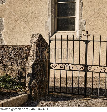 Talloires, France - September 08 2020 : A Window At The Saint Germain And The Iron Gate With A Cross