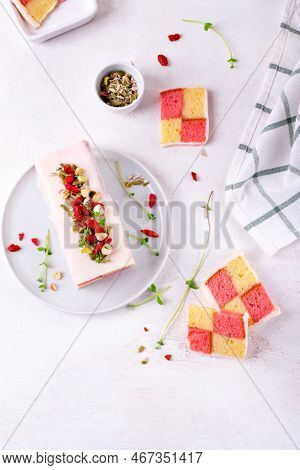 Battenberg Cake, Traditional British Dessert With Two-colored Sponge Cake Wrapped In Marzipan, On Wh