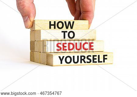 How To Seduce Yourself Symbol. Concept Word How To Seduce Yourself On Wooden Blocks. Businessman Han