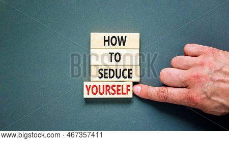 How To Seduce Yourself Symbol. Concept Word How To Seduce Yourself On Wooden Blocks. Businessman Han