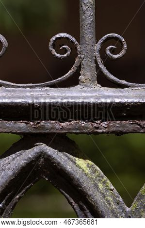 Curly Cues Accent An Ornate Wrought Iron Fence In Savannah, Georgia
