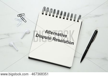 Notebook With Inscription Alternative Dispute Resolution And Stationery On White Marble Table, Flat 