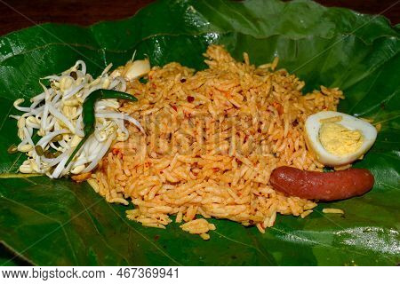 Famous Kyangin Rice Salad Wrapped  In Leaf Parcel. Favorite Street Food In Asian, Myanmar.