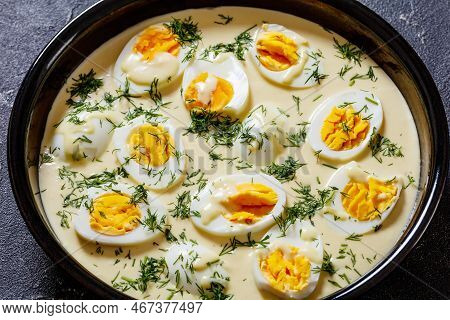 Senfeier,  Hard Boiled Eggs In Rich Creamy Mustard Sauce In Black Bowl On Concrete Table, German Cui