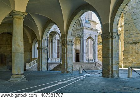 Italy, Bergamo, The Portico Of The Palece Of Reason Woth The Cathedral Square In The Background