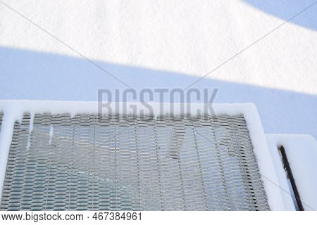 Stairway On A Snow Covered Roof In Winter