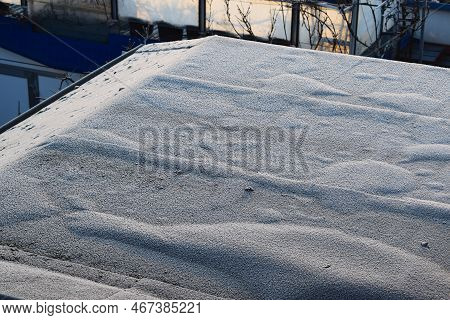 Dark Flat Roof With Thin White Ice