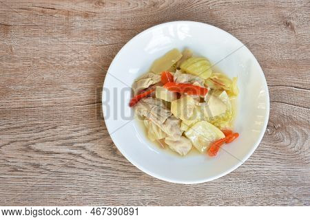 Stir Fried Pickled Cabbage With Pork Innards And Stomach And Chili On Plate