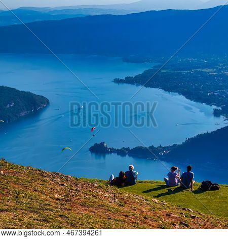 Talloires, France - September 08 2020 : People Are Sitting And Having A Picnic Enjoying The View Ove