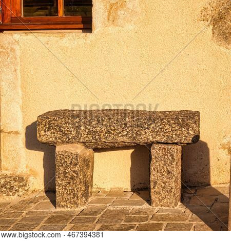 Menthon Saint Bernard, France - September 10 2020 : Historic Medieval Stone Bench Outside Infront Of