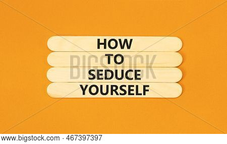 How To Seduce Yourself Symbol. Concept Word How To Seduce Yourself On Wooden Sticks. Beautiful Orang