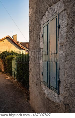 Talloires, France - September 08 2020 : The Outside Op A French Alpine Home With Shutters Next To Th