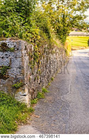 Menthon Saint Bernard, France - September 10 2020 : The Historic Stone Protection Wall Of A Castle O
