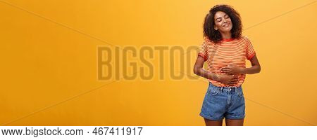 Mmm Delicious Meal Warming Me Inside. Delighted Stuffed Good-looking Stylish Young Female In Striped